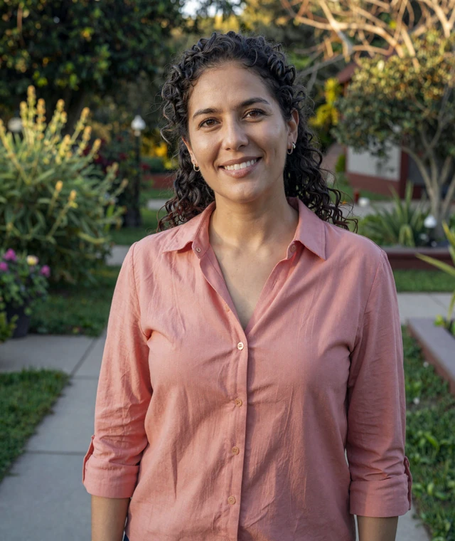 Valeria near a garden path in afternoon light, reinforcing trustworthy profile discovery on a Latin dating site